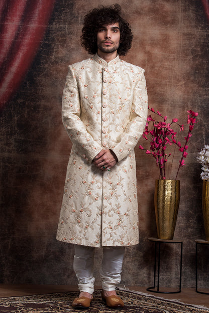 Ivory Sherwani And Churidars With Peach Hints