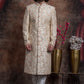 Ivory Sherwani And Churidars With Peach Hints