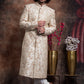 Ivory Sherwani And Churidars With Peach Hints