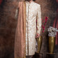 Ivory Sherwani And Churidars With Peach Hints