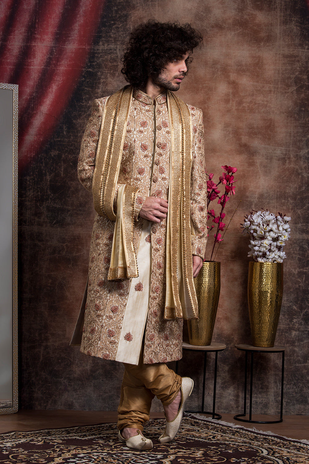 Ivory Sherwani And Churidars With Aari Work