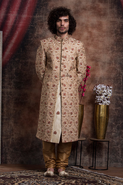 Ivory Sherwani And Churidars With Aari Work